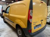 a yellow van that is parked in a garage
