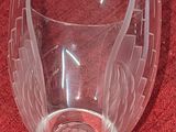 a wine glass that is sitting on a red cloth
