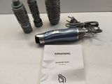 a hair dryer and a blow dryer sitting on a table
