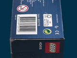 a box of legos sitting on a blue surface
