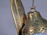 a lamp that has a bird on top of it