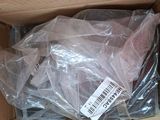 a cardboard box with a bunch of plastic items inside of it
