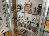 a glass display case with many different items in it