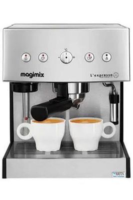 a close up of two cups of coffee in front of a machine