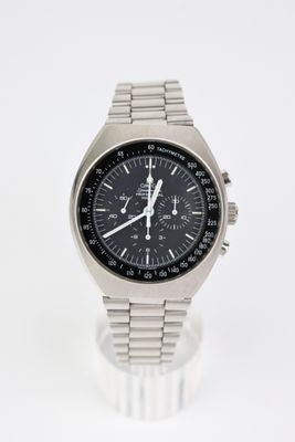 a close up of a watch on a white surface with a white background