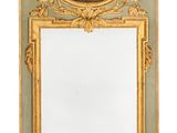 an image of a mirror with a picture of a ship on it