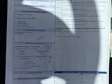 a paper with a picture of a car ' s driver ' s license on it