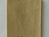 a close up of a piece of paper on a white surface