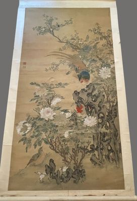 an old chinese painting of a bird and flowers on a wall