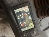 a close up of a motorcycle dashboard with a clock on it