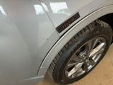 a close up of a car tire with a sticker on it
