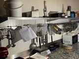 a kitchen counter with a bunch of utensils on it