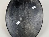 an image of a black plate on a white surface