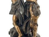 bronze statue of a woman and two children on a pedestal