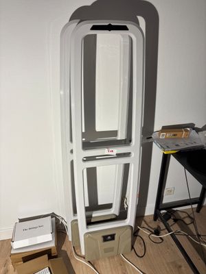 a computer sitting on top of a box in the middle of a room