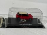 a small red car in a clear case