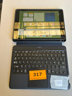 a laptop computer sitting on a table with a price tag on it