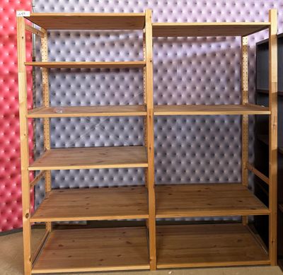 a shelf that has a bunch of books on it