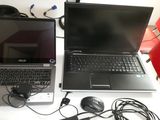 two laptops that are sitting on a table