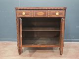 an old wooden cabinet with drawers and a shelf on top of it