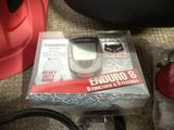 a box with a cell phone in it sitting on the floor