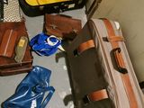 many pieces of luggage sitting on the floor next to each other