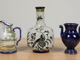 three vases sitting on a table next to each other