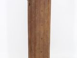 an old wooden cylinder with a metal handle on a white background