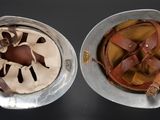 two bowls of ice cream and chocolate on the table