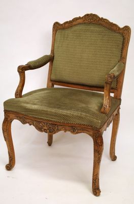 an image of a chair with a green upholstered seat on a white background