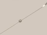 an image of a silver bracelet with a flower design on it