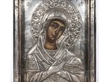 a silver plate icon of the mother of jesus