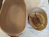 a basket and a bowl on a towel on a table