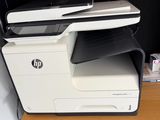 a printer that is sitting on top of a desk