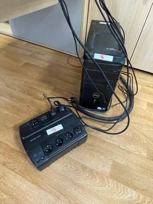 two speakers that are connected to each other on the floor