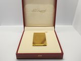 a gold bar in a red case on a white surface