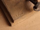 a small piece of wood that has a stamp on it