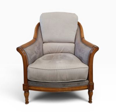 a close up of a chair with a gray upholstered seat