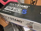 a box of rockstand guitar strings on a shelf