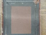 an old picture frame sitting on top of a wooden floor