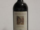 a bottle of wine that is sitting on a table