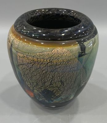 a vase that is sitting on a white surface