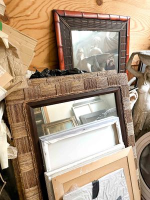 a pile of assorted items on a shelf in a room