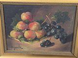painting of a basket of fruit with grapes and peaches on a table