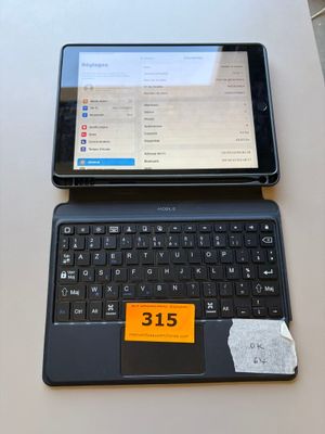 a laptop and a tablet sitting on a table next to each other
