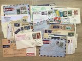 many different types of letters and envelopes laid out on a table