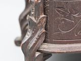 a close up of a metal object on a white surface