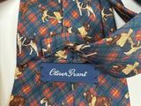 a tie with dogs on it on a table