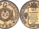 une vieille pièce de monnaie sur laquelle figure l'image d'un homme tenant une épée