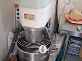an image of a kitchen with a mixer and other items